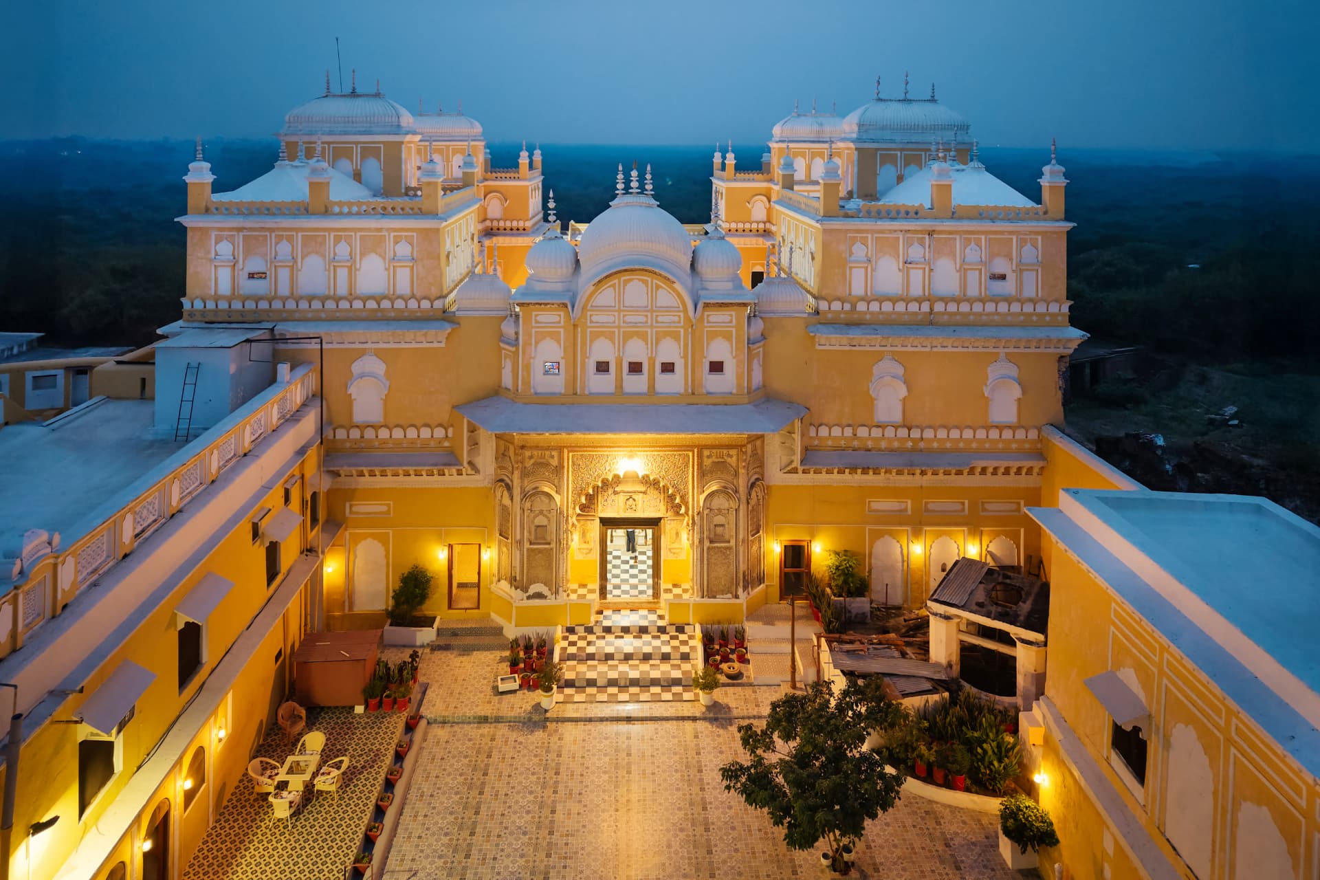 Manek Chowk courtyard at Fort Rampura illuminated at dusk