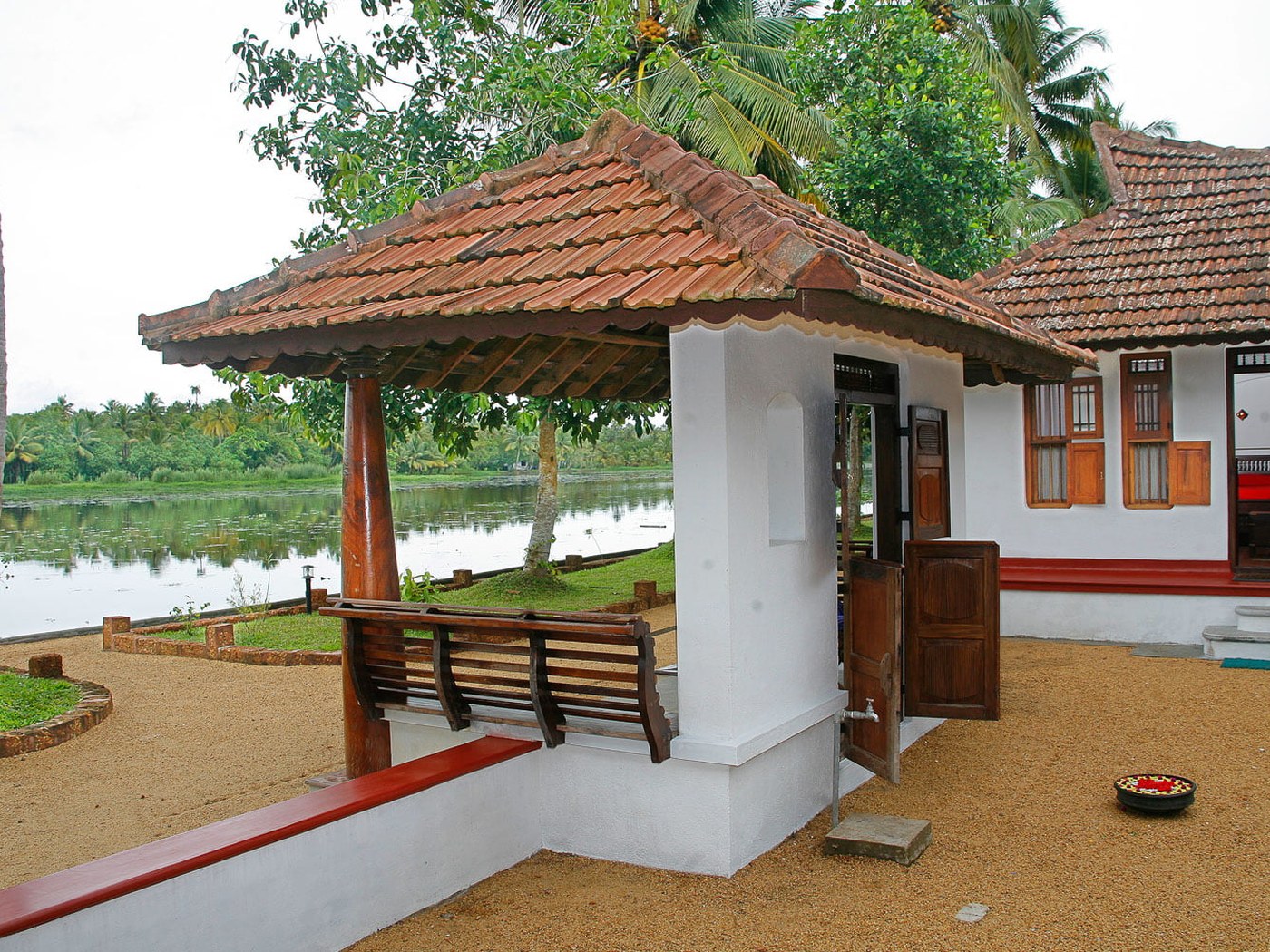 A waterfront villa veranda at a family-run farm on the Kerala backwaters