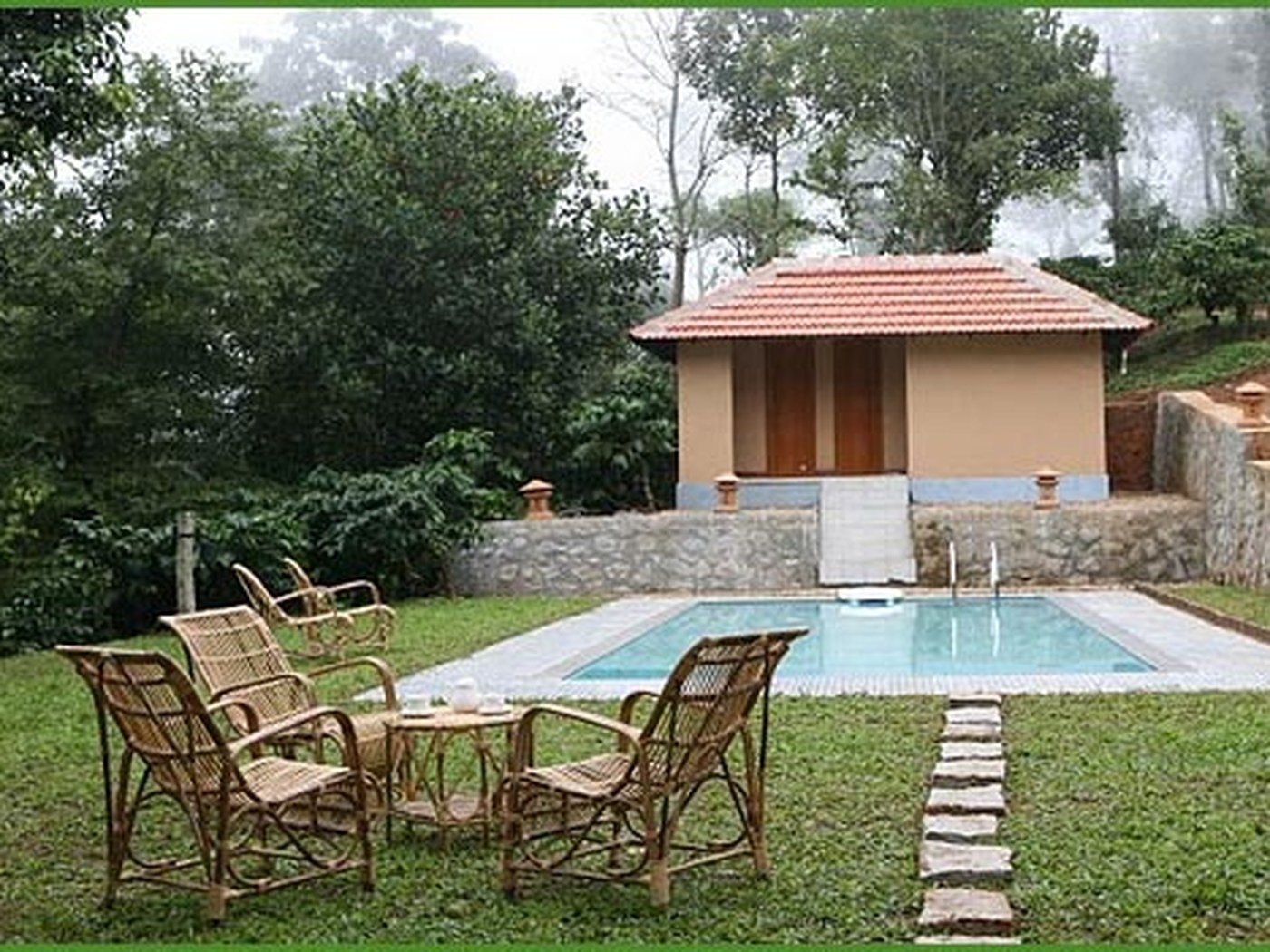 Pool and garden cottage at My Garden of Eden in Wayanad