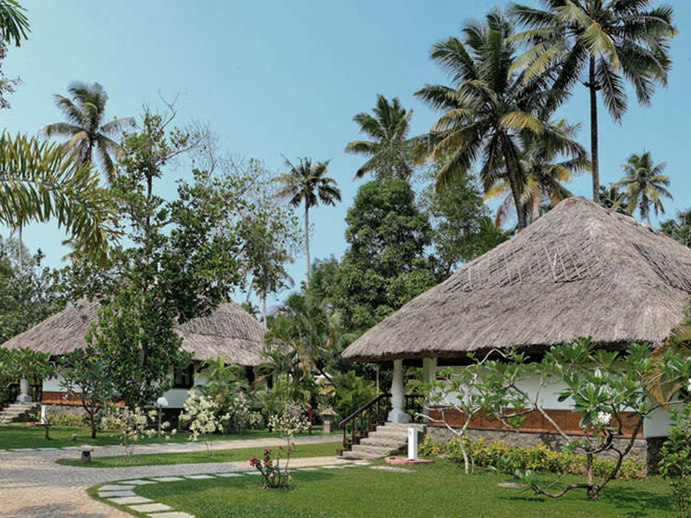 Thatched villas and tropical gardens at Carnoustie Ayurveda and Wellness Resort