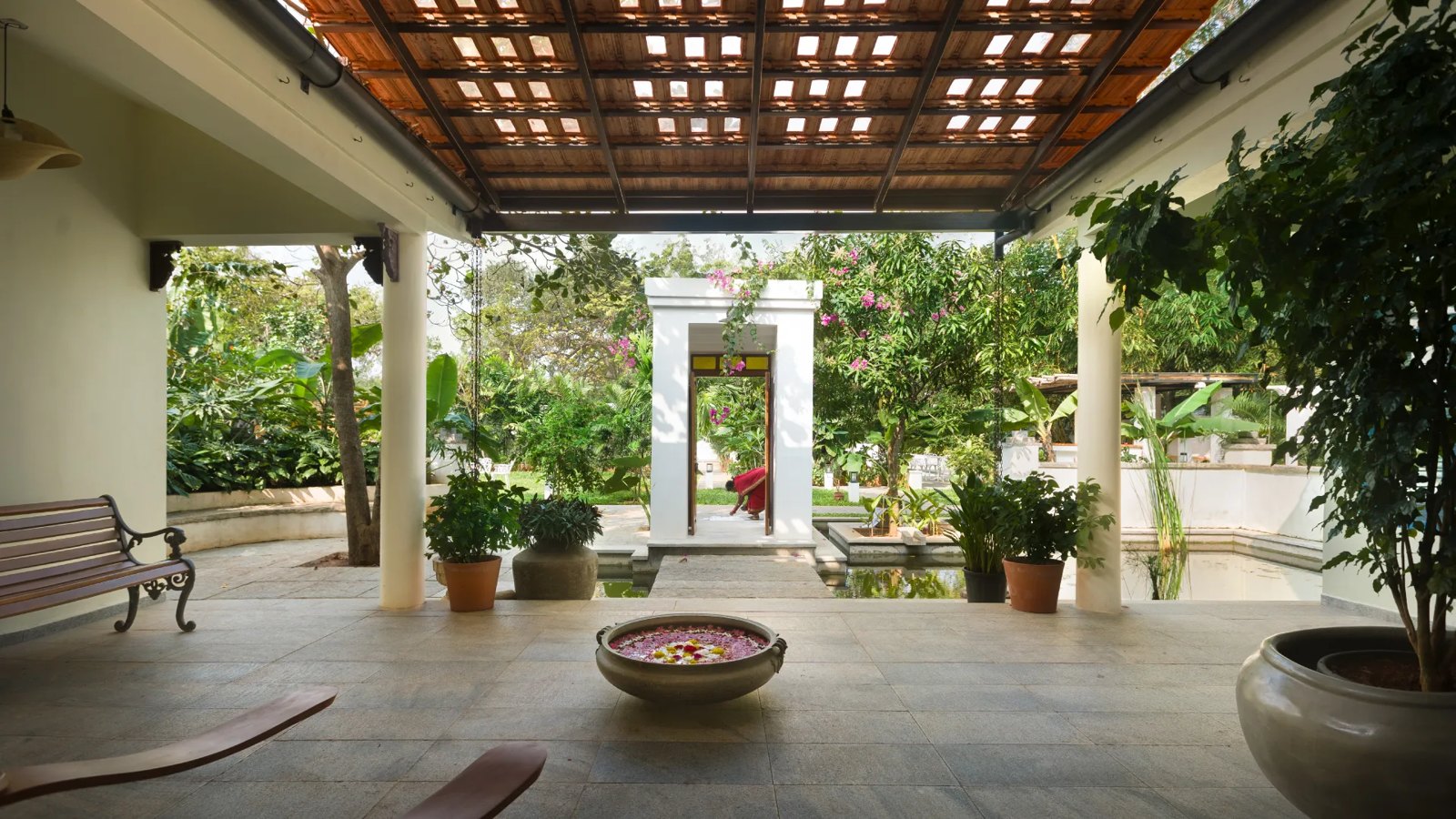 Covered verandah overlooking the gardens at Isai Karai Bungalow