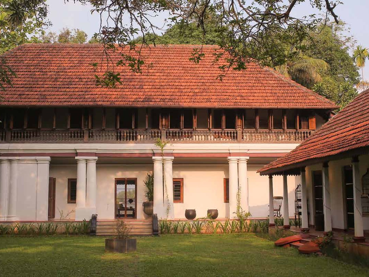 Tiled roof and pillared verandah of Chittoor Kottaram beside the backwaters