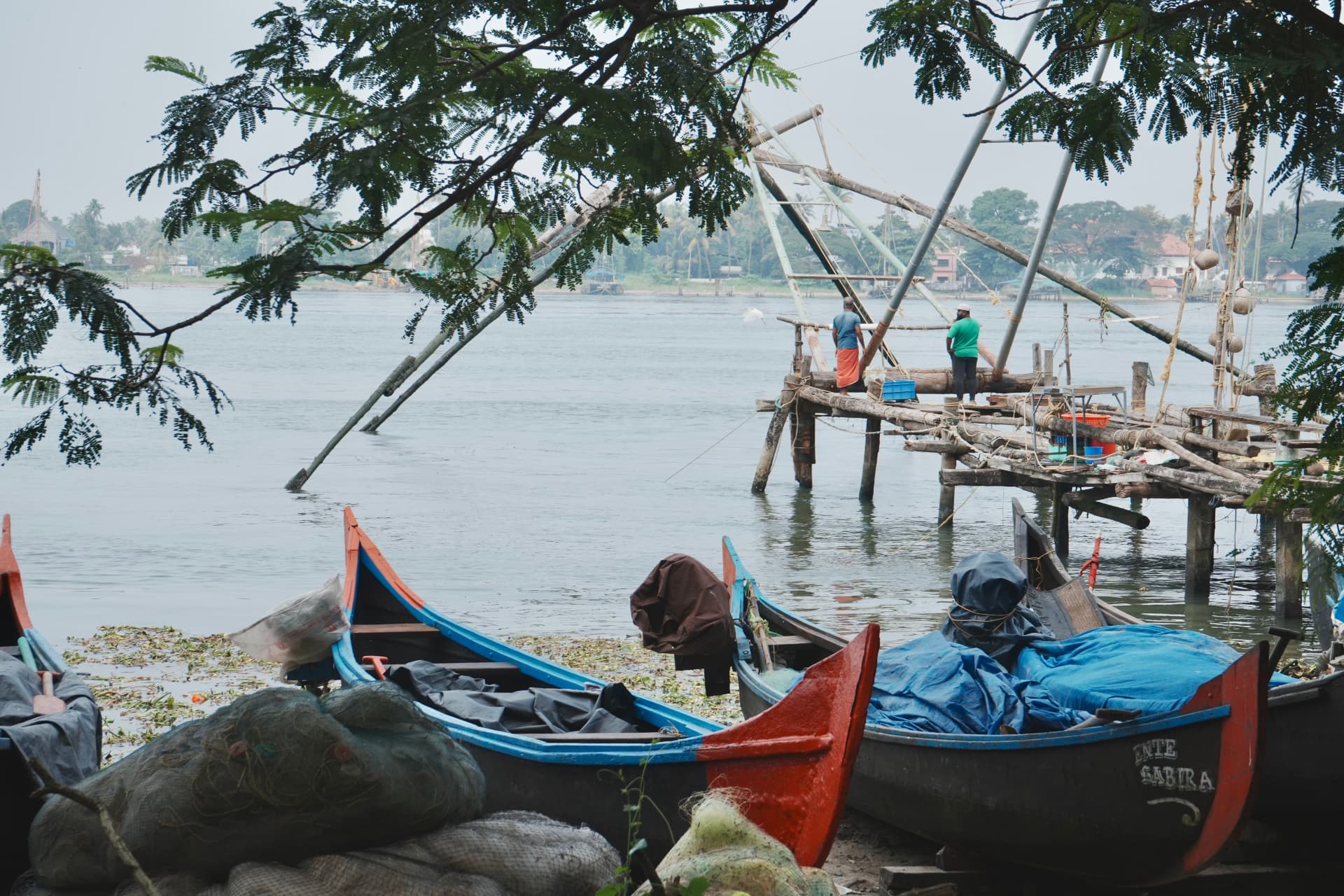 Fishing boats and Chinese fishing nets along the Fort Kochi waterfront