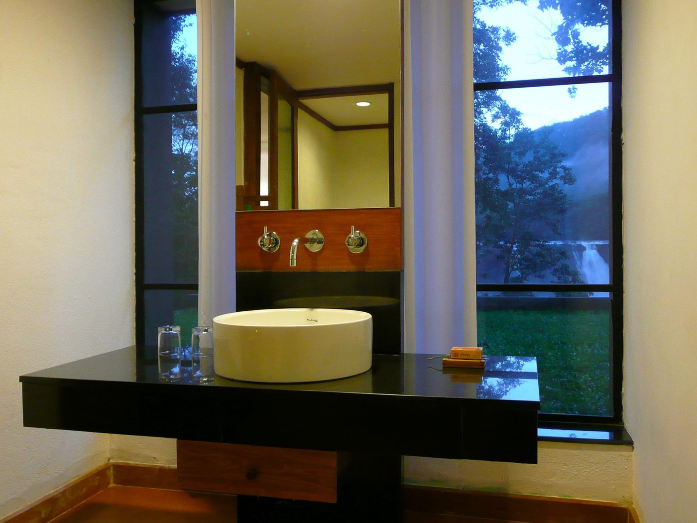 Luxury room. wash counter facing the falls at Rainforest Athirampally