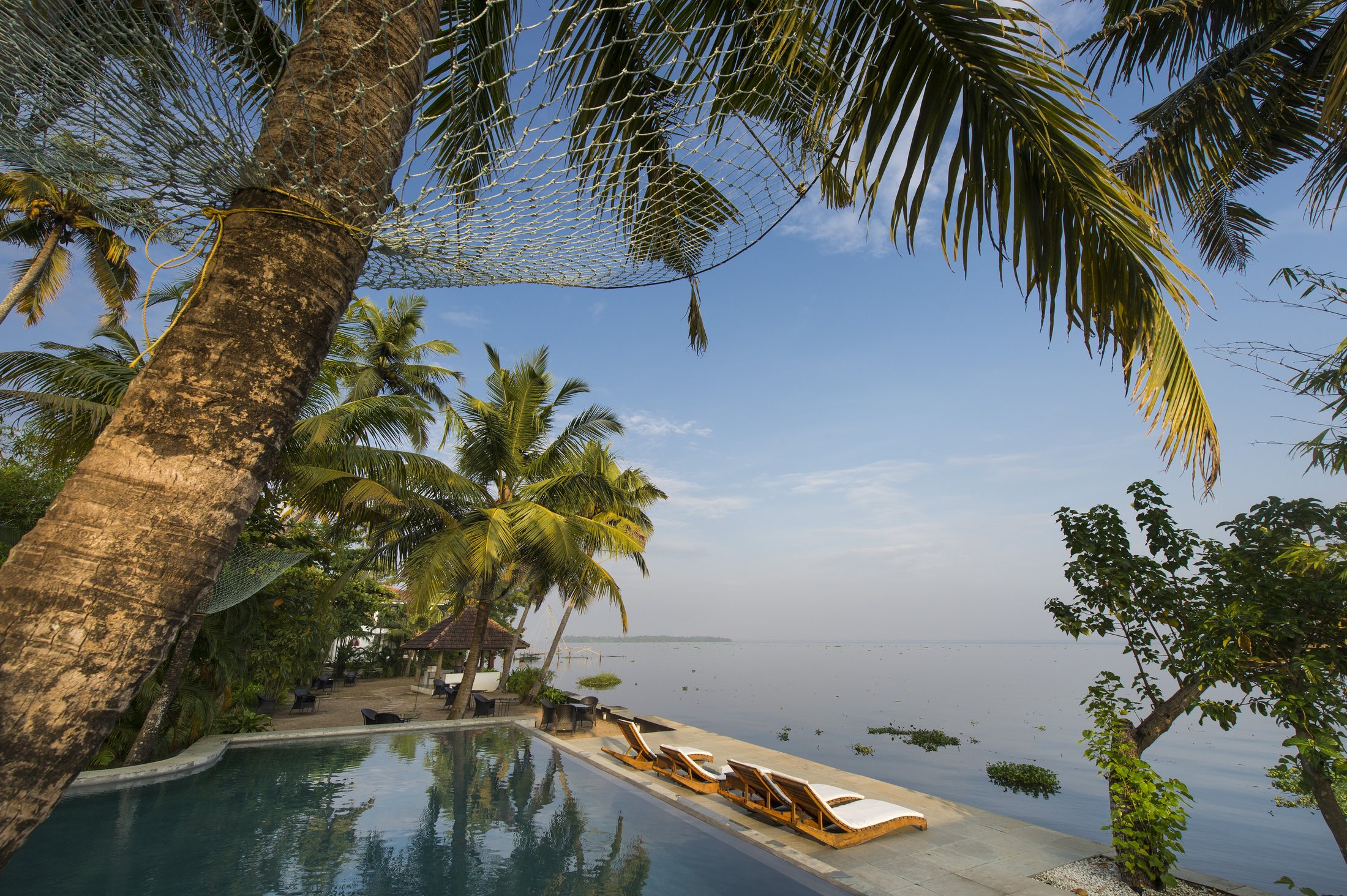 Pool terrace beside Lake Vembanad at The Purity