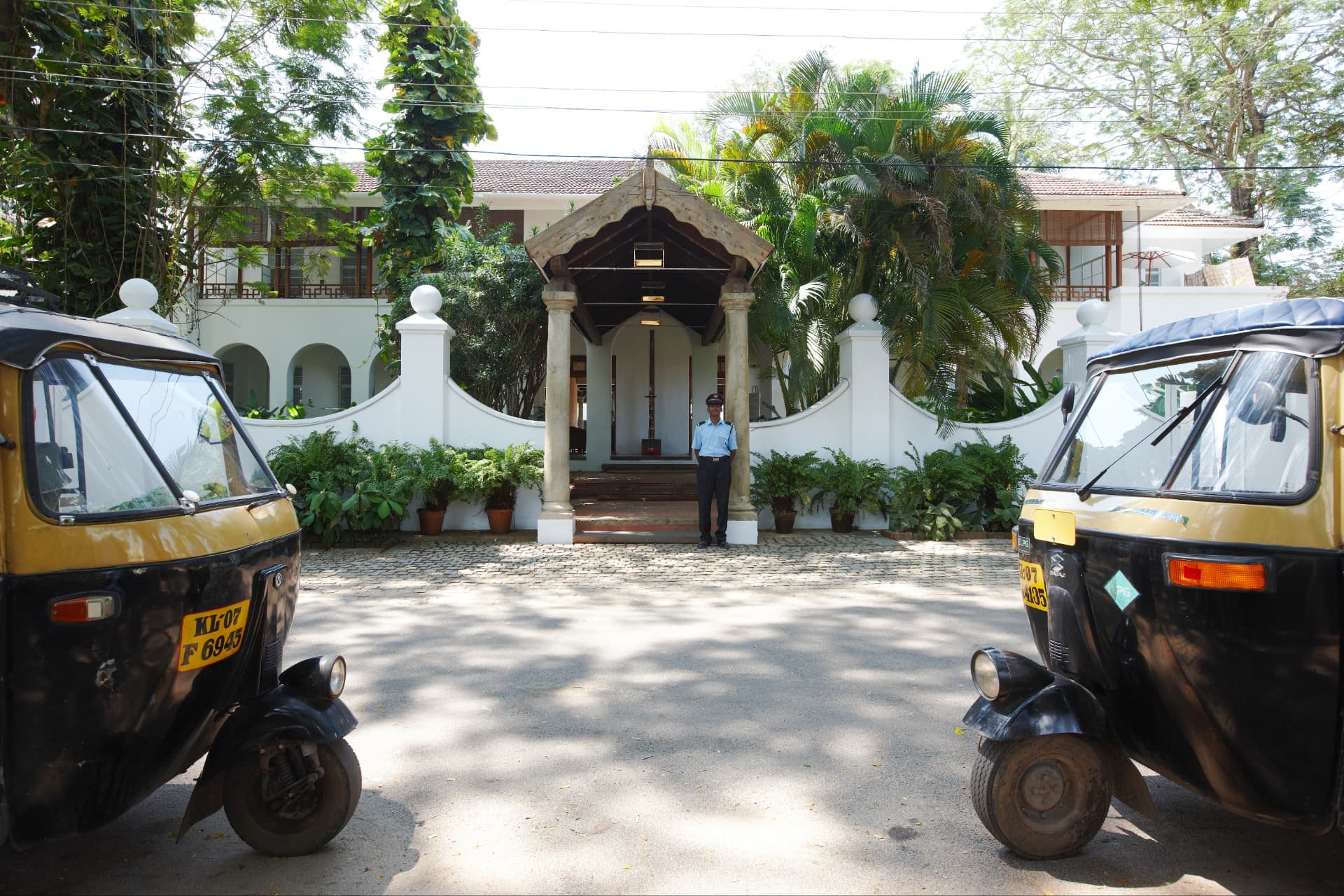 Entrance of The Malabar House with Fort Kochi auto rickshaws