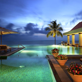 A palm fringed hotel pool on the Kerala coast